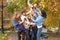 Group Of Teenage Friends Throwing Leaves