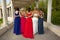 A Group of Teenage Girls from the back posing in their Prom Dresses