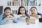 Group of teenage girls looks bored in the library