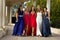 A Group of Teenage Girls walking in their Prom Dresses