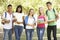 Group Of Teenage Students Standing In Park