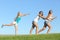 Group of teenager girls playing throwing water