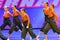 Group of teenagers dancers performing at the dance competition
