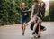 Group of teenagers enjoying outdoors with skateboard