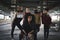 Group of teenagers gang standing indoors in abandoned building, bullying concept.