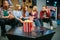 Group of teenagers relax on couch in cinema hall