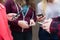 Group Of Teenagers Sharing Text Message On Mobile Phones