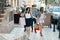 Group of teenagers with shopping bags on city street