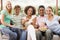 Group Of Teenagers Sitting On A Couch