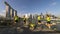 Group of teens jump shot with city skyline background.