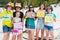 a group of teens with signs to welcome the Royals