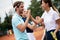 Group of tennis player handshaking after playing a tennis match. Fairplay, sport concept.