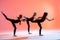 group of three ballet girls in black tight-fitting suits dancing on red background with their long hair down