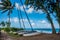 Group of three catamarans framed by trees on Waimanalo Beach, Hawaii