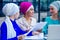 Group of three caucasian Muslim office lady discussing with a businesswoman partner job interview shawl and turban on