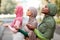 Group Of Three Diverse Islamic Women Praying Outdoors Wearing Hijab