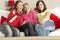 Group Of Three Girls Watching TV