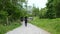 Group of three hikers walking footpath in Wales