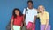 Group of three multi-ethnic teenage students with backpack and folders