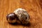 Group of three quail eggs on a wooden table, top view, close-up, selective focus, copy space.