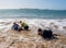 Group of three senior women laughing as falling down in the water on beach. Humor senior health