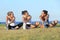 Group of three women stretching after sport