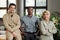 Group of three young multicultural employees in casual attire