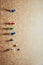 Group of thumbtacks pinned on corkboard. Texture background