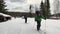 A group of tired tourists with backpacks are skiing along the trail. Ski trip in the forests of Russia. Beautiful winter landscape
