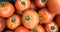 Group of tomatoes lying on a pile on top of each other, tomato texture. Selective focus, for content creation