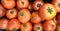 Group of tomatoes lying on a pile on top of each other, tomato texture. Selective focus, for content creation