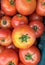 Group of tomatoes lying on a pile on top of each other, tomato texture. Selective focus, for content creation