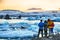 Group of tourist looking Beautifull landscape with floating icebergs in Jokulsarlon glacier lagoon at sunset