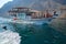 A group of tourist watching wild dolphin in Oman.