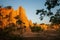 Group of tourists at ancient scenic landscape at sunset. The Sao Din Na Noi site displays picturesque scenery of eroded sandstone