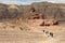 Group of Tourists approach the Screw Mountain in Timna Park. Israel