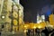 Group of tourists in center of Prague at night