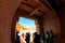 Group of tourists enters the central gate of ancient Berber fortress - Ksar Ait Ben Haddou