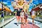 Group of tourists exploring buddhist temple in thailand