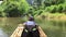 A group of tourists floats on the river. Girl 9 years old sailing on a raft on a river in Asia. Travel concept