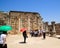 Group of tourists gather at the archaeological ruins of a synagogue at the town of Capernaum