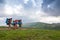 Group of tourists hikers with backpacks standing in mountains