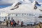 Group of tourists looking at the glacier at the stony shore