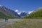 Group of tourists man and woman goes to mountains glacier Actru Russia