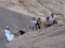 Group of tourists next to a petroglyph in the Wadi Rum desert, Jordan