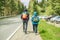 Group of tourists people hiking at mountains with sports backpack. Travel adventure concept. Group of female friends