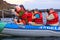 Group of tourists photographing from a dinghy near Bartolome isl