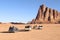 Group of tourists rides on pickup truck through Wadi Rum desert