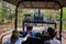 Group of tourists in shuttle vehicles touring the Rajiv Gandhi National Park in Nagarhole, India