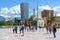 Group of tourists on Skanderbeg square. Efem Bey Mosque, Clock Tower, Plaza Hotel, Tirana, Albania